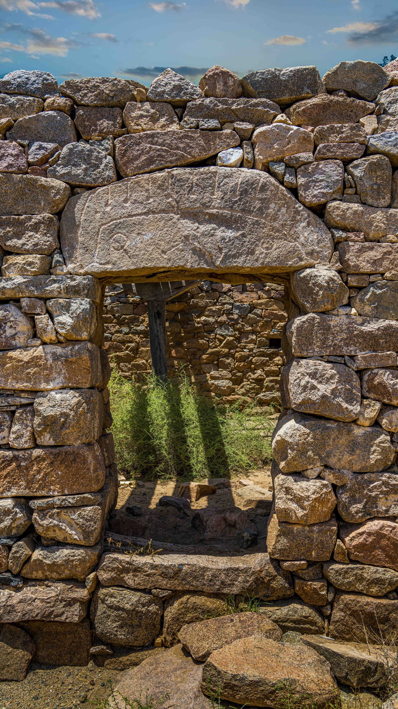 enterance to a house with ancient sympoles